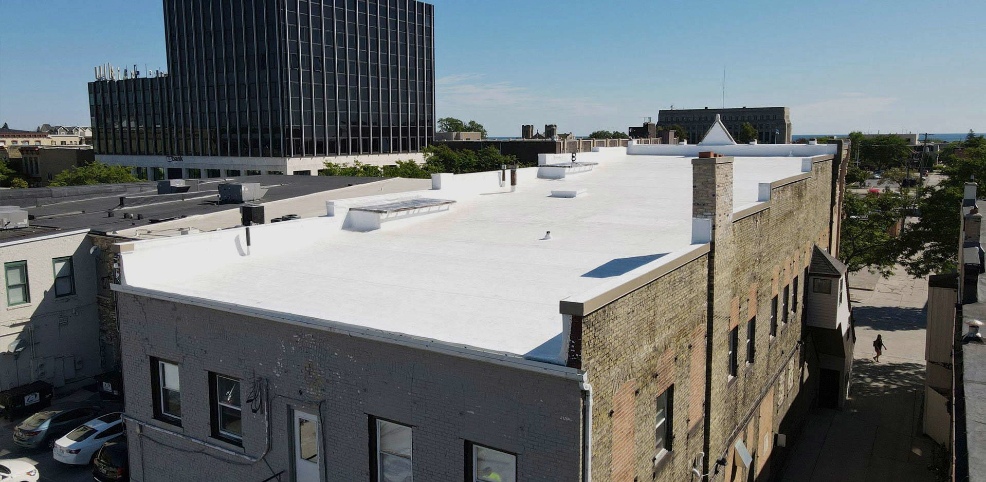 Flat Roof Of A Commercial Building — Oostburg, WI — Custom Craft Roofing & Construction LLC