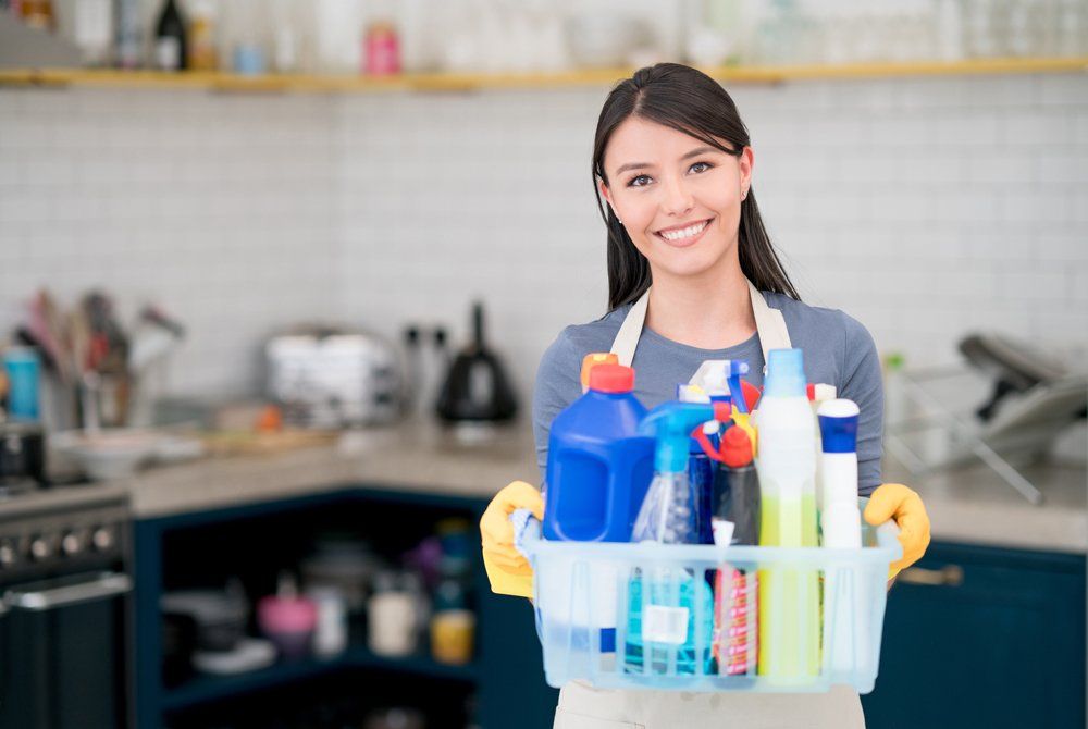 Female Worker Holding The Cleaning Products - Houston, TX - All Premiere Service Solutions