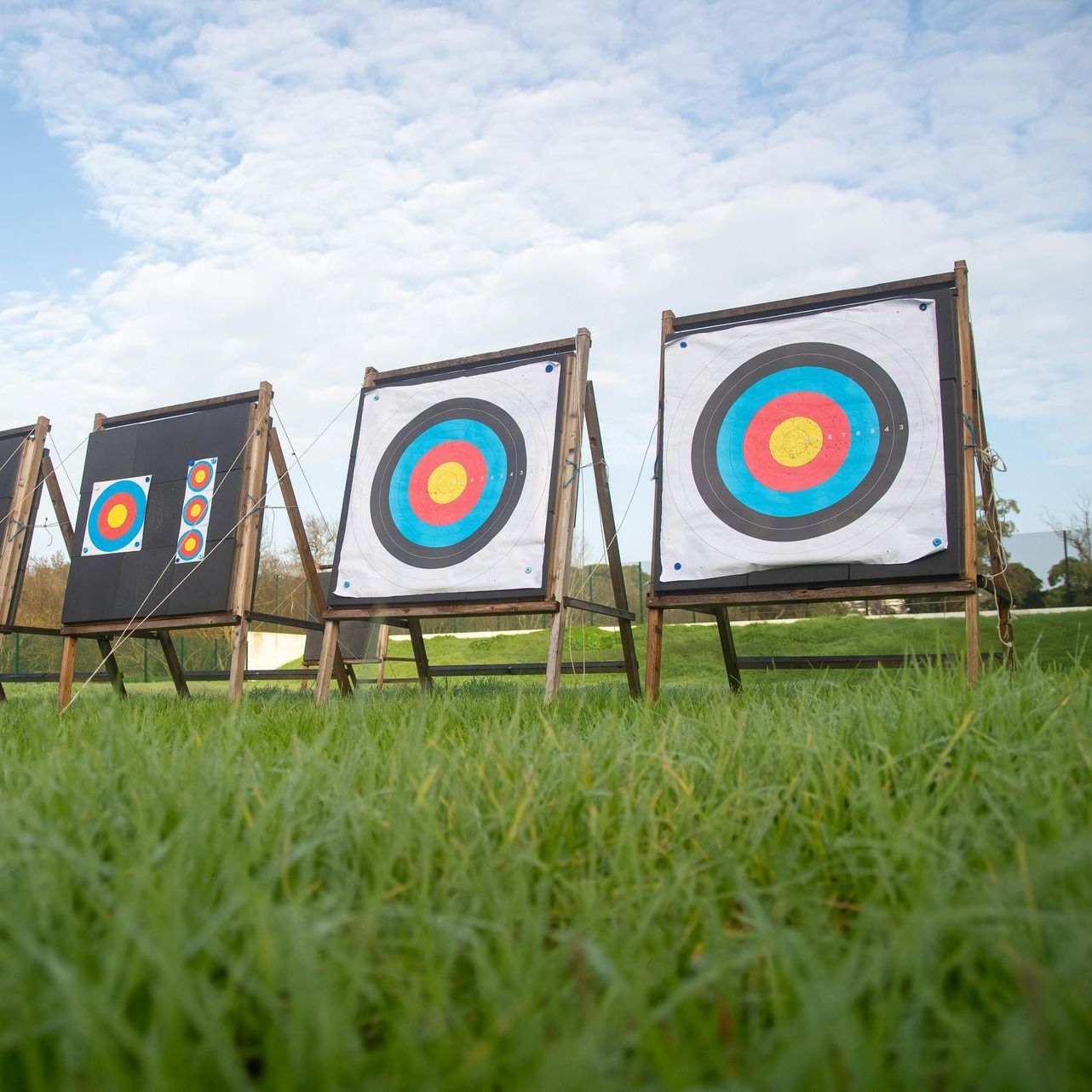 A man is swinging a golf club on a golf course