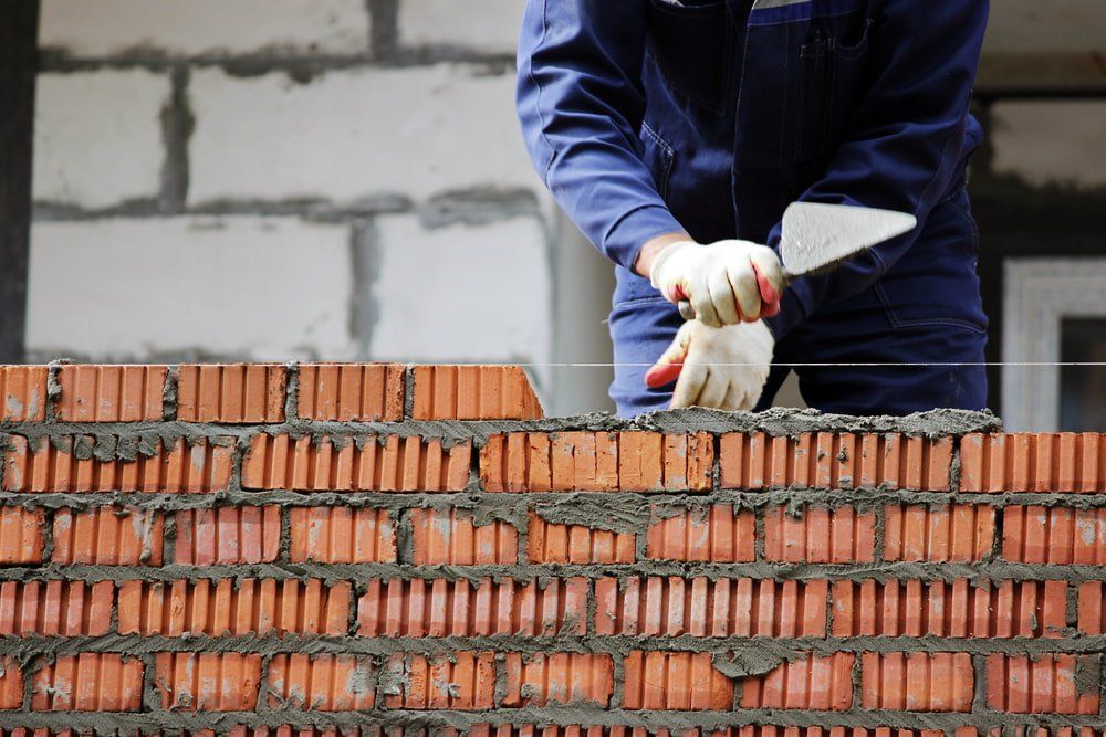 Worker Laying Bricks — Builders in Bathurst, NSW