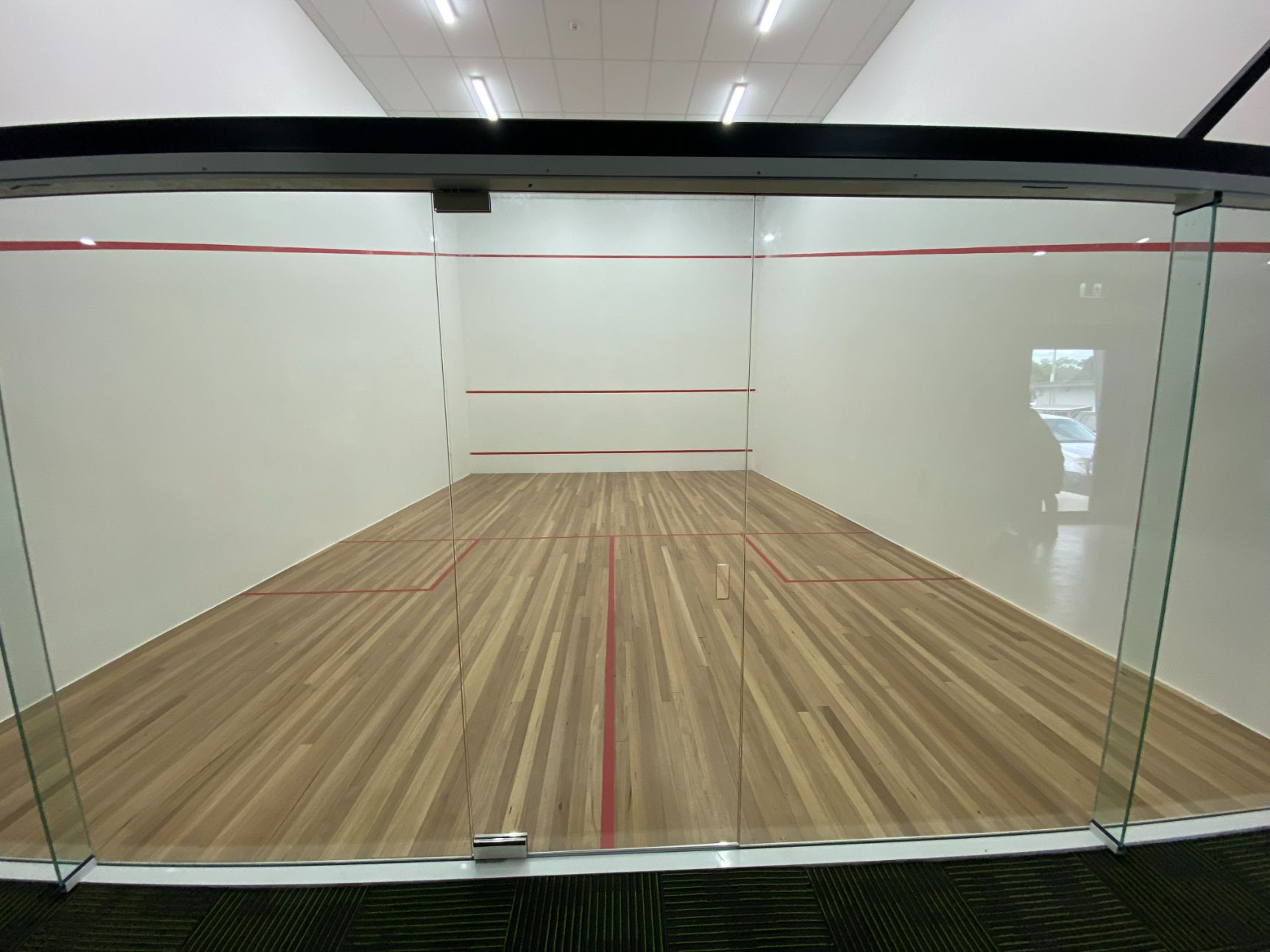 Room With Glass Door Inside Muswellbrook Golf Club — Builders in Bathurst, NSW