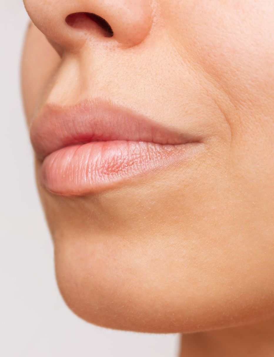 A close up of a woman 's lips and nose