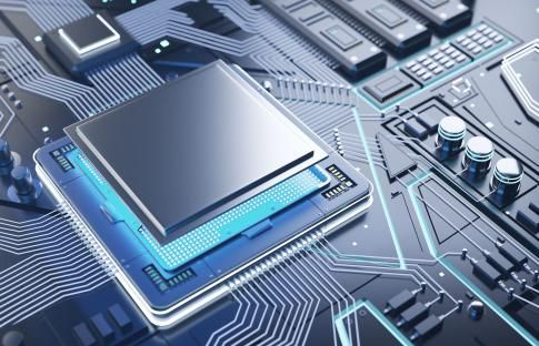 A computer chip is sitting on top of a motherboard.