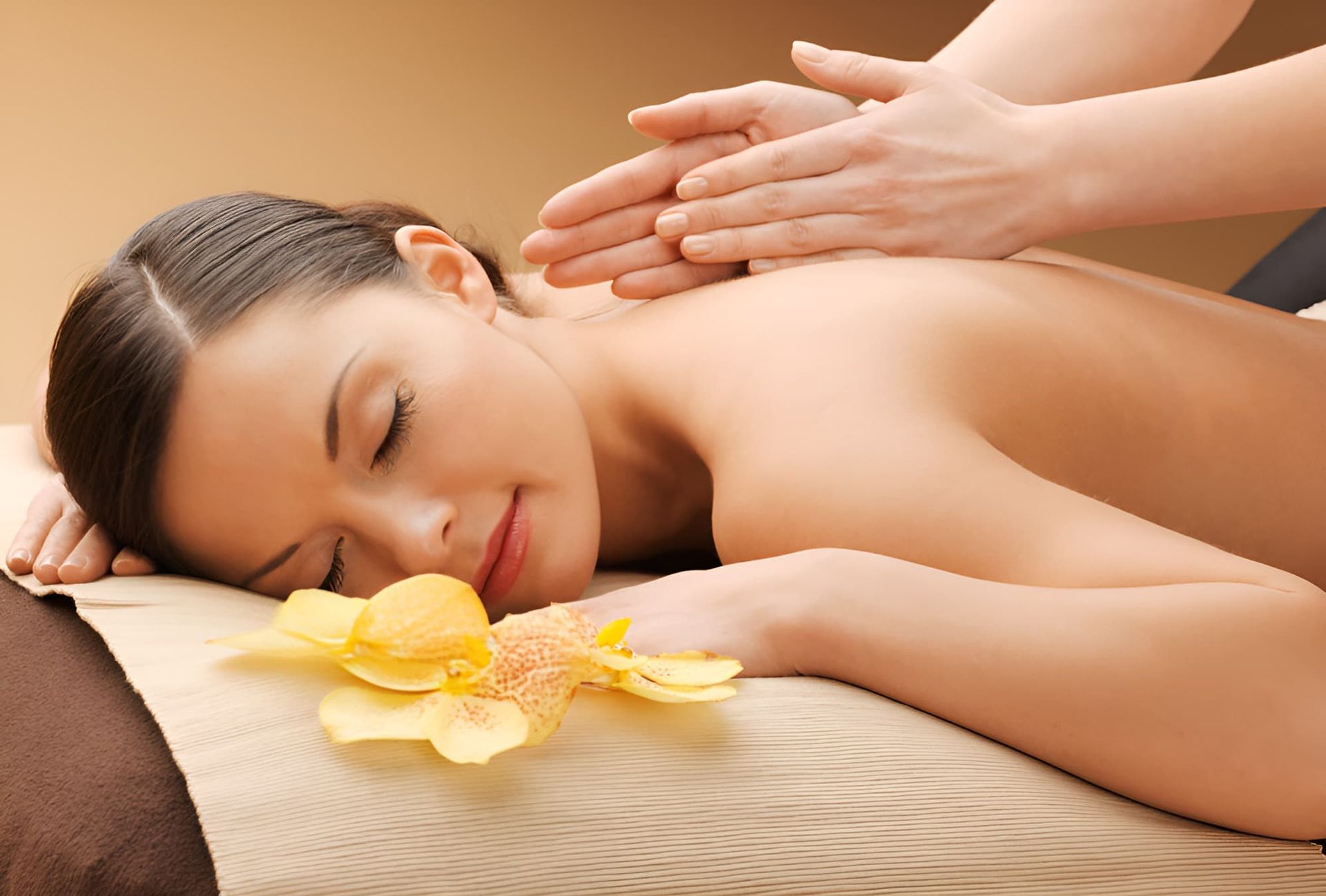 A Woman Is Laying On A Table Getting A Massage — Back In Motion Chiropractic & Healthcare In Innisfail, QLD