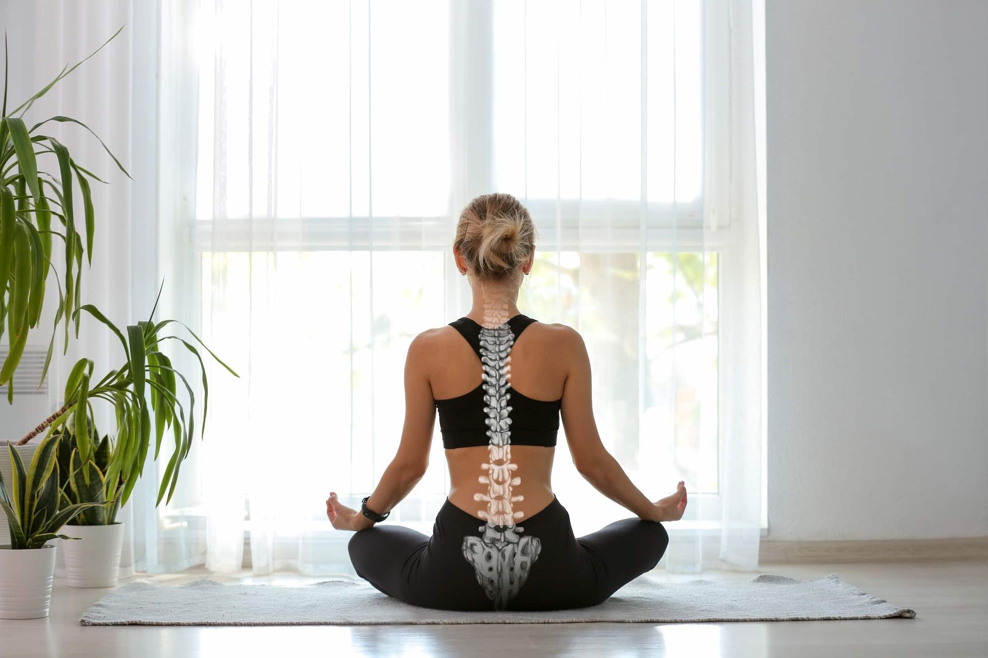 A Woman Is Sitting In A Lotus Position On A Yoga Mat — Back In Motion Chiropractic & Healthcare In Innisfail, QLD
