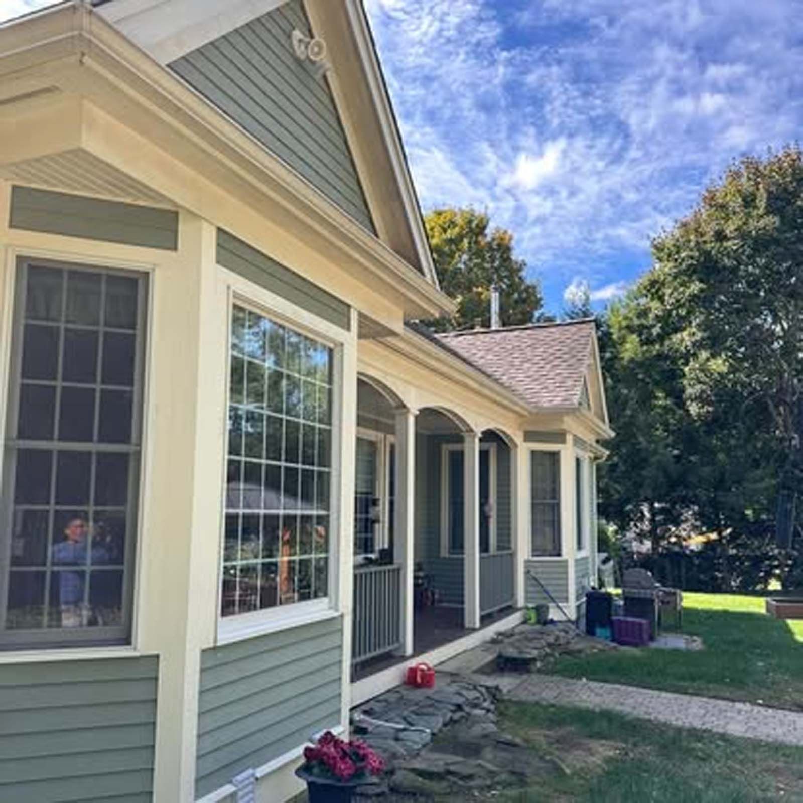 A house with a porch and a lot of windows