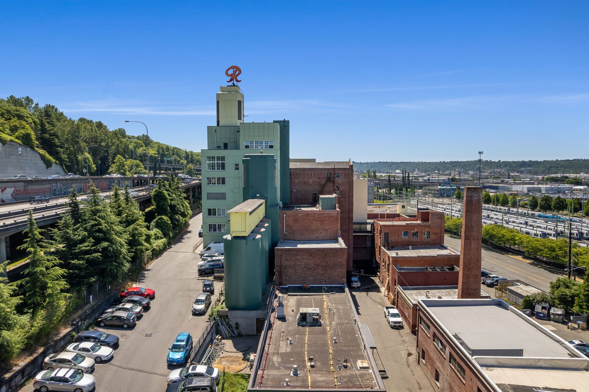 exterior photo of the old rainier brewery including the historic R Logo