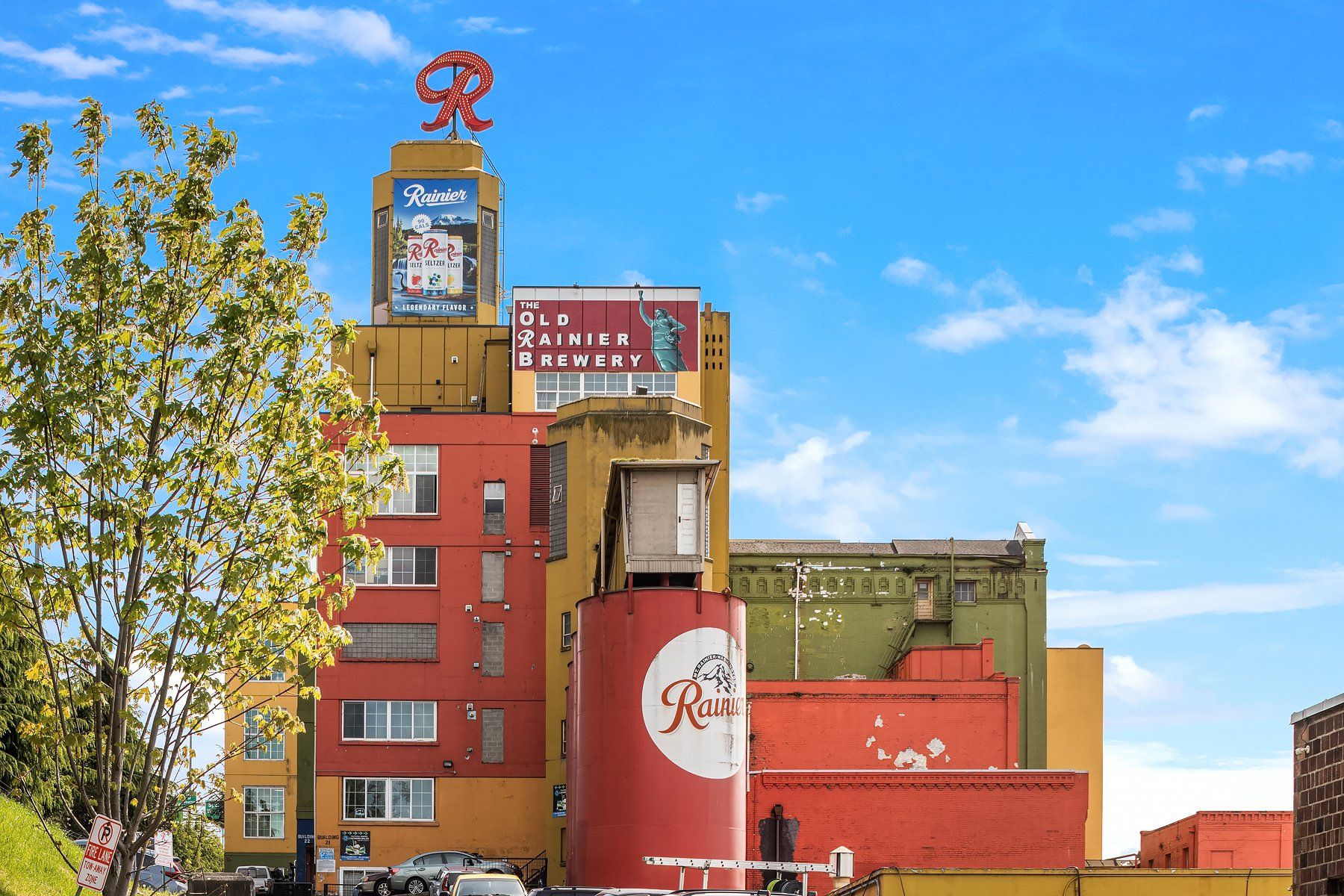 exterior photo of the old rainier brewery including the historic R Logo