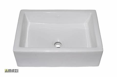 A white square sink with a hole in the middle on a white background.