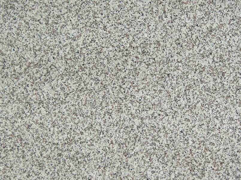 A close up of a gray and white carpet texture.