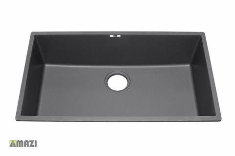 A black kitchen sink with a hole in the middle on a white background.