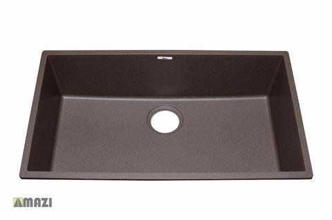 A brown kitchen sink with a hole in the middle