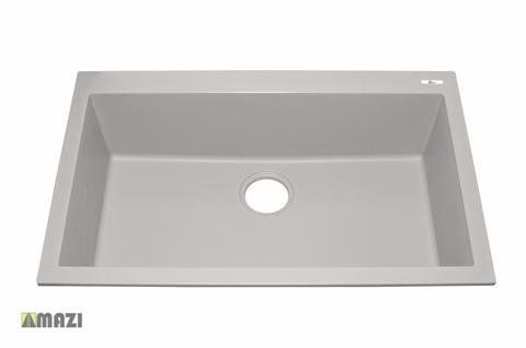 A gray kitchen sink with a hole in the middle on a white background.