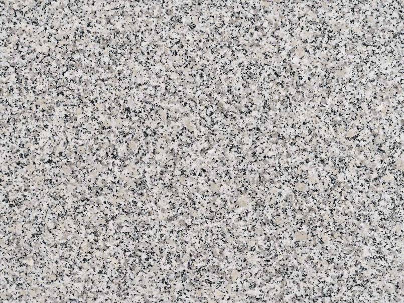 A close up of a gray granite counter top.