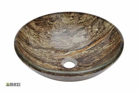 A round glass sink with a hole in the middle on a white background.