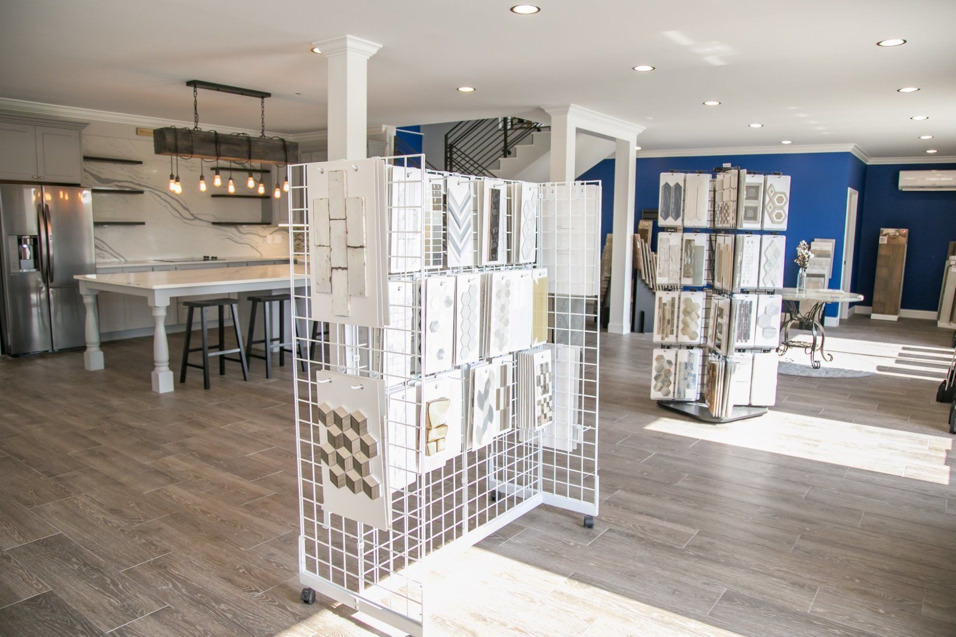 A large room with a lot of shelves and a table in it.
