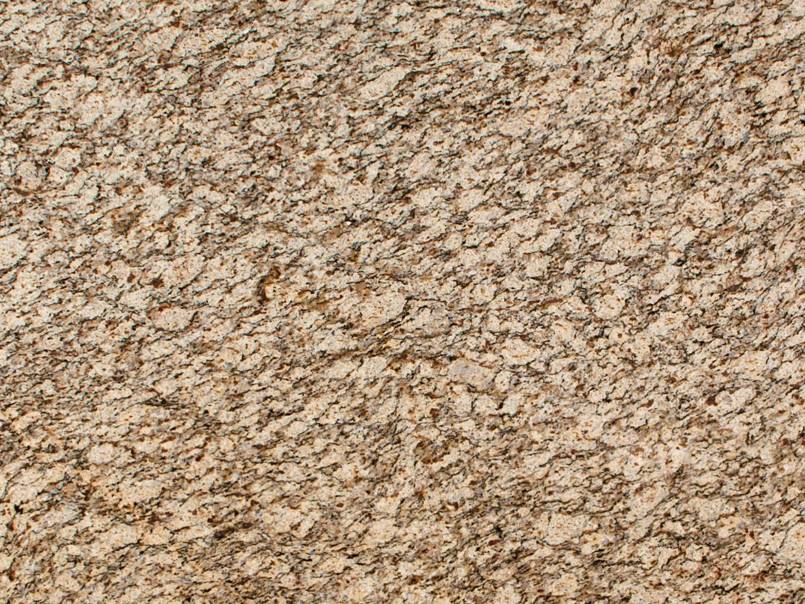 A close up of a brown granite counter top.