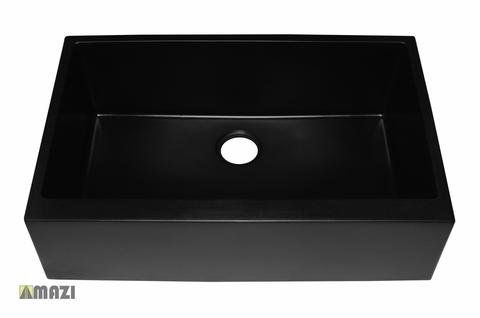 A black sink with a hole in the middle on a white background.