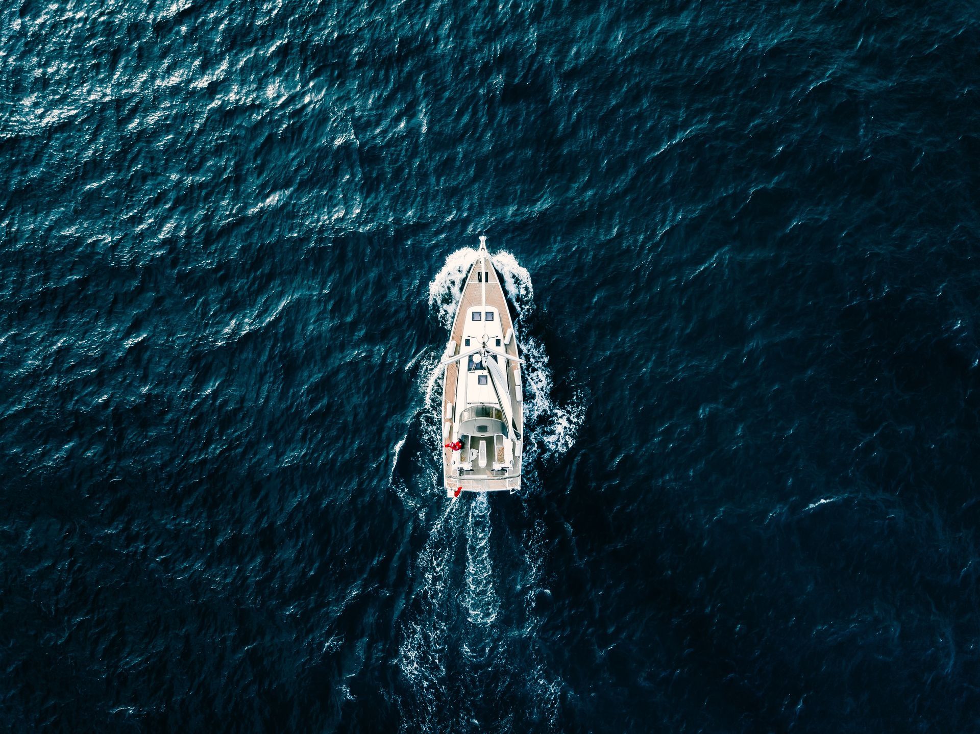 An aerial view of a boat in the ocean