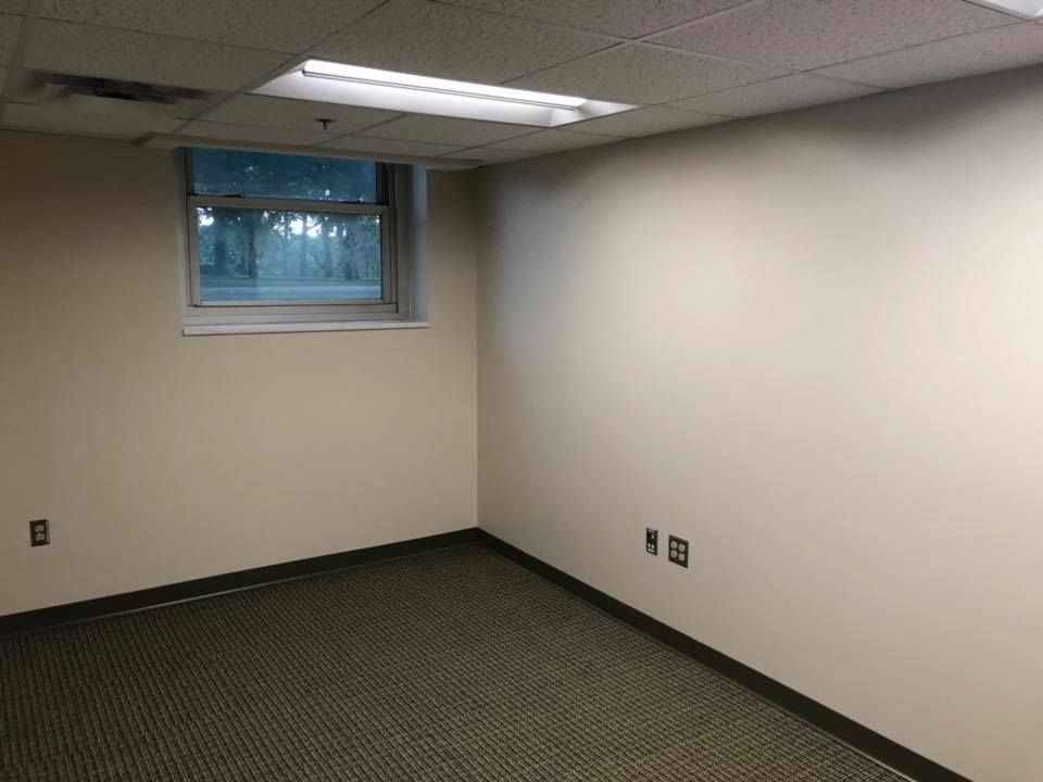 There is a window in the corner of the room.