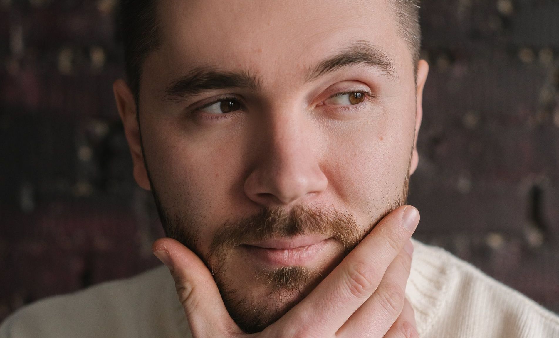 TMJ Relief. Image: a man holding his jaw