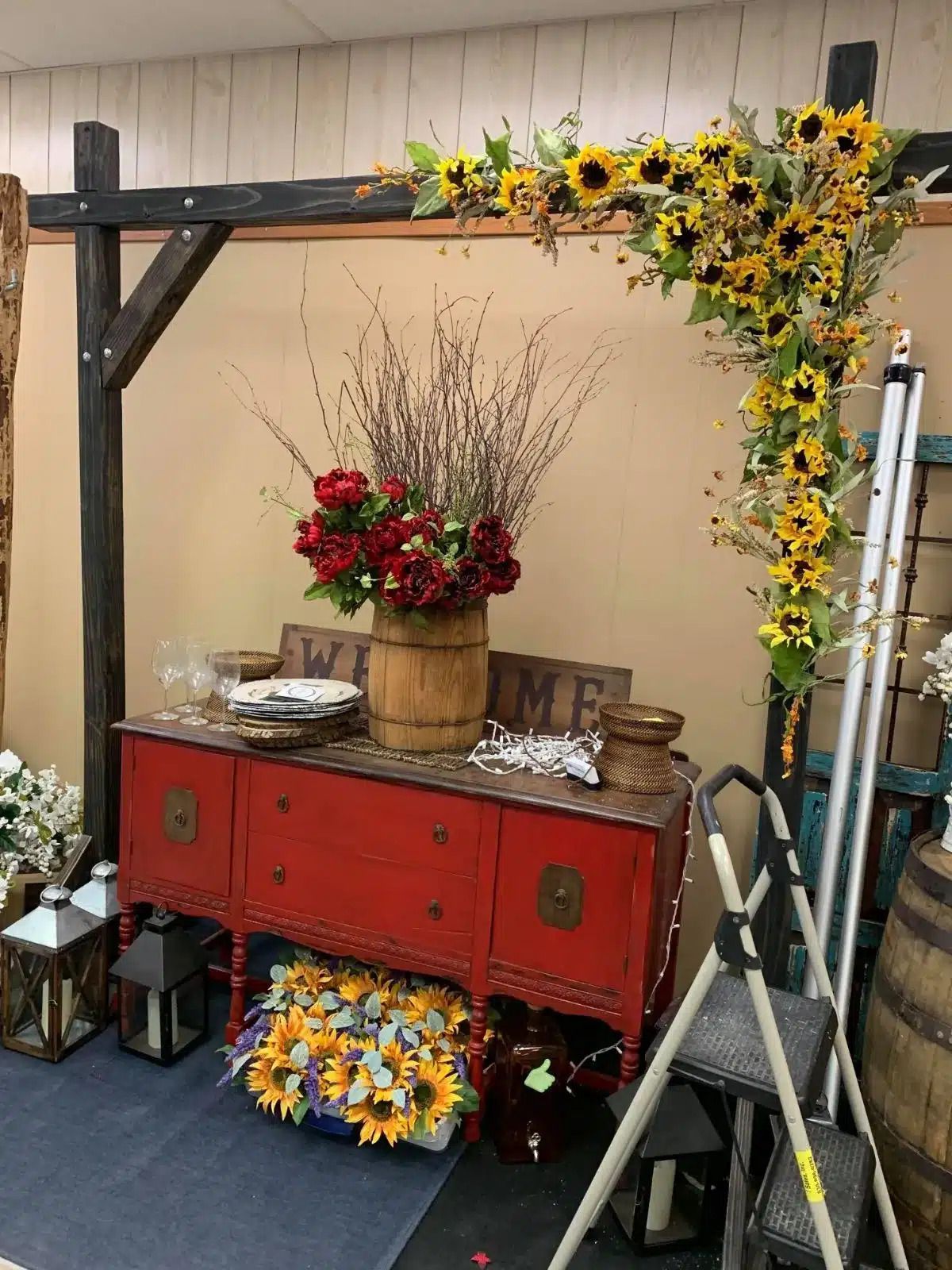 Dresser decorated with flowers and other beautiful touches