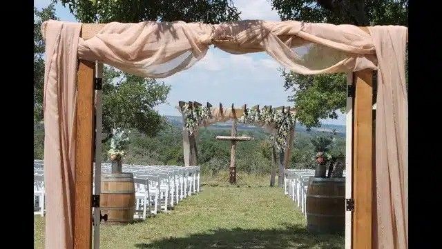 wedding tent on a grassy meadow in a forest