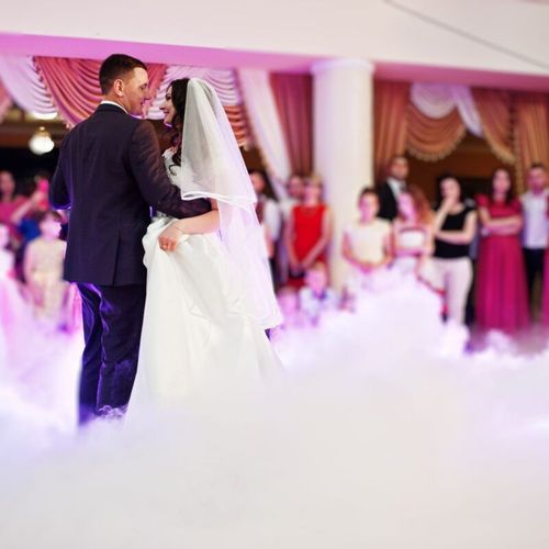 first wedding dance with smoke and rose purple lights