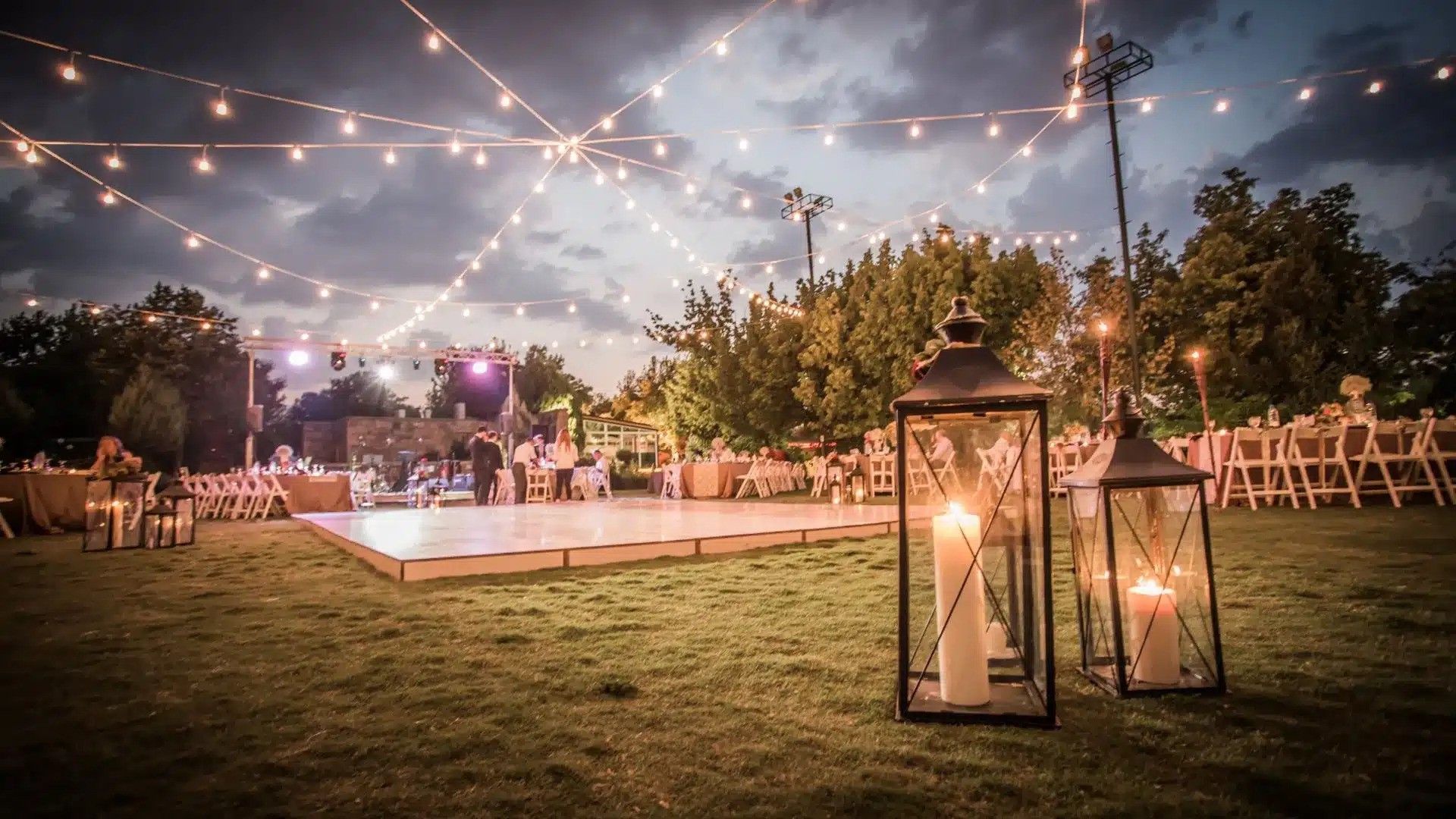 wedding tent on a grassy meadow in a forest