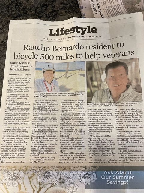 Newspaper clipping: A Rancho Bernardo resident plans to bicycle 500 miles to help veterans. Includes photos of the man on a bike and headshot.