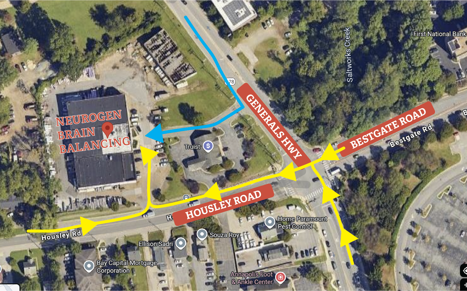 Aerial view of a road intersection in blue (north) and yellow (west and south) arrows showing traffic flow on Generals Hwy, Bestgate Rd, and Housley Rd.