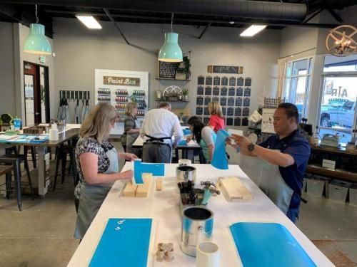 A group of people are sitting at tables in a room.