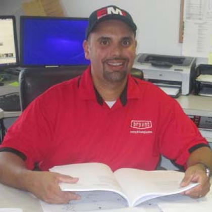 A man wearing a red shirt with the word apparel on it