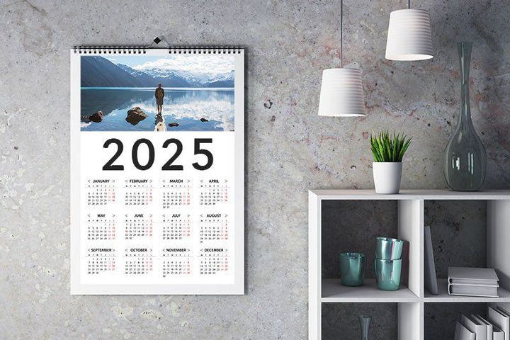 2025 calendar hanging on wall surrounded by decorations.