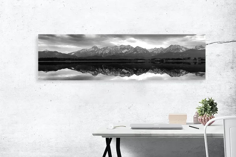 Three large canvas prints of wave on wall
