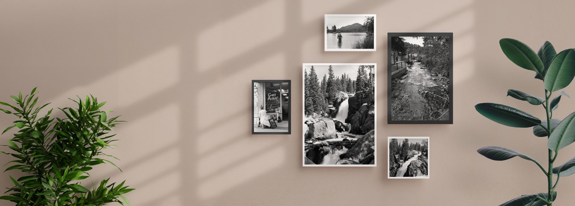 Wall of black and white photographs of memorable traveling experiences