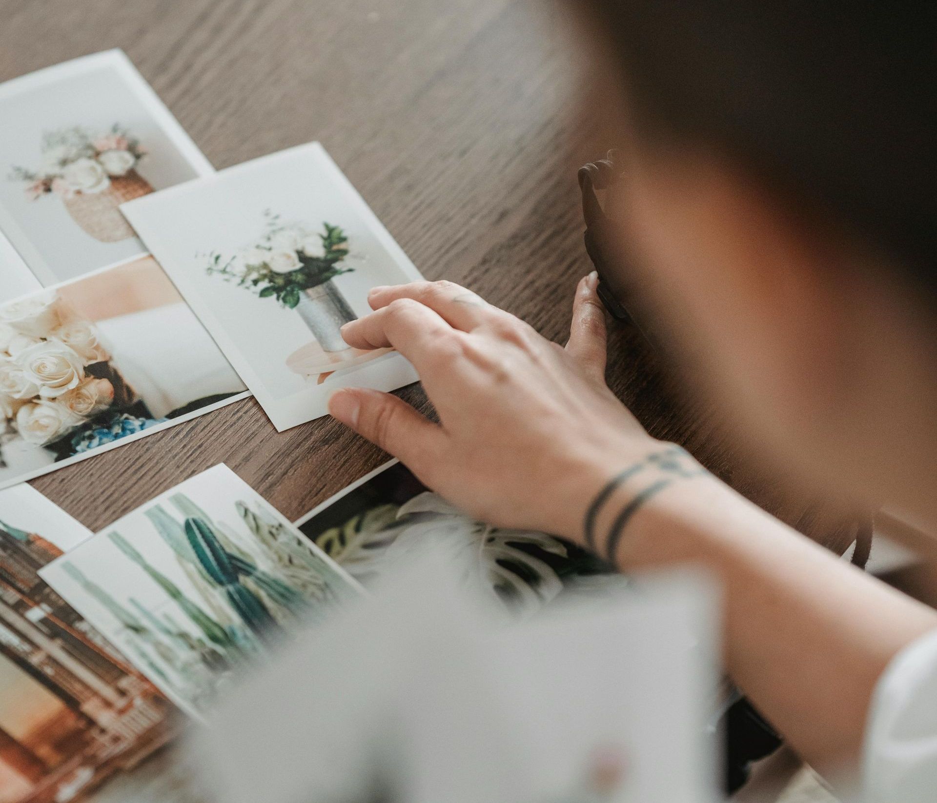 Scattered pile of wedding photos of a couple.