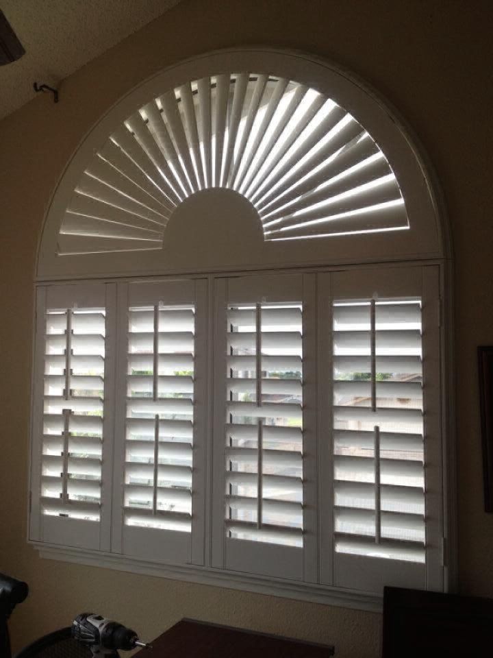 view of a room window with installed blinds