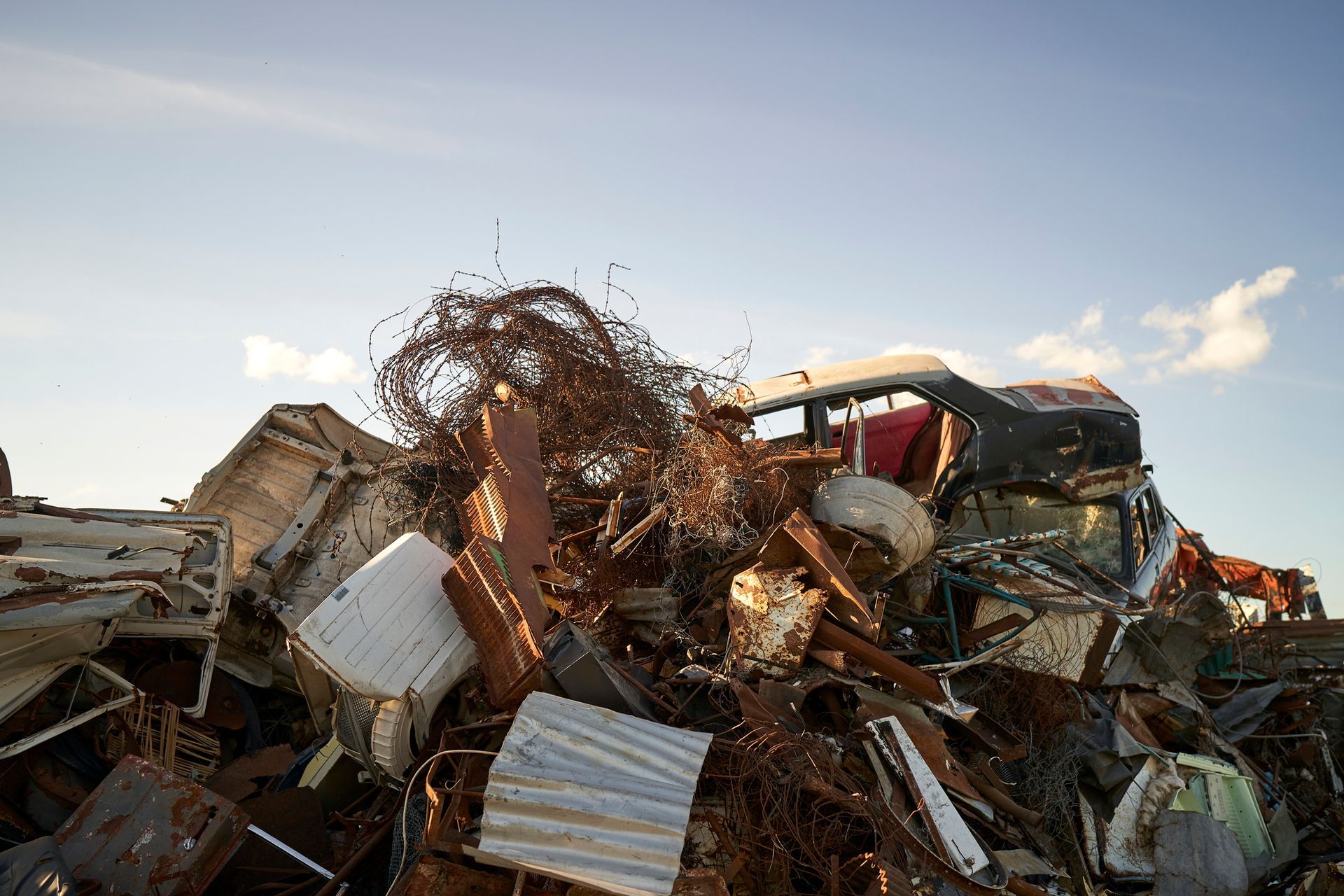 A close-up of a mound of scrap metal, representing effective commercial junk removal services.