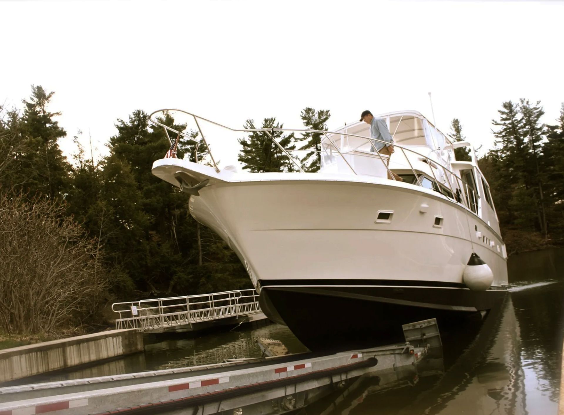 A large white boat is docked in a body of water