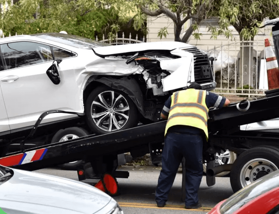 flatbed tow truckhelps a local citizen with a broken down car in millford mill, MD