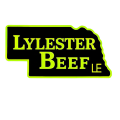 Logo for Lylester Beef, featuring text on a black shape of Nebraska with green outline.