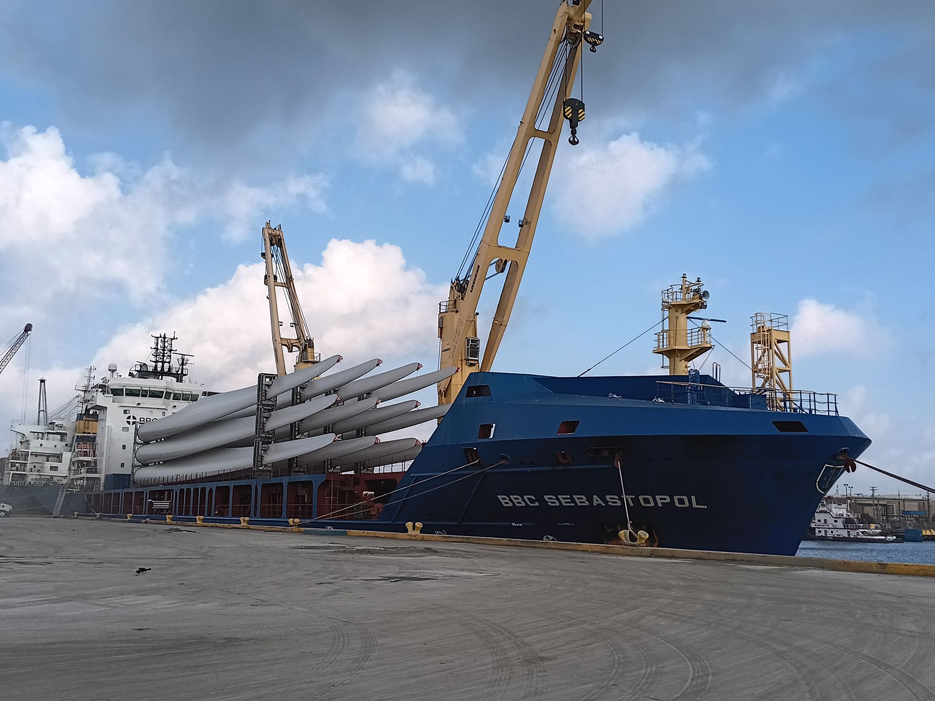 A large container is being lifted by a crane