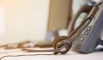 SIP Trunking — Close Up Headset of Call Center and VOIP Telephone in Fair Oaks, CA