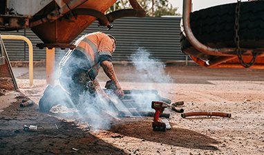 Man Working on Construction Site  — Transport Maintenance & Engineering in Braitling, NT