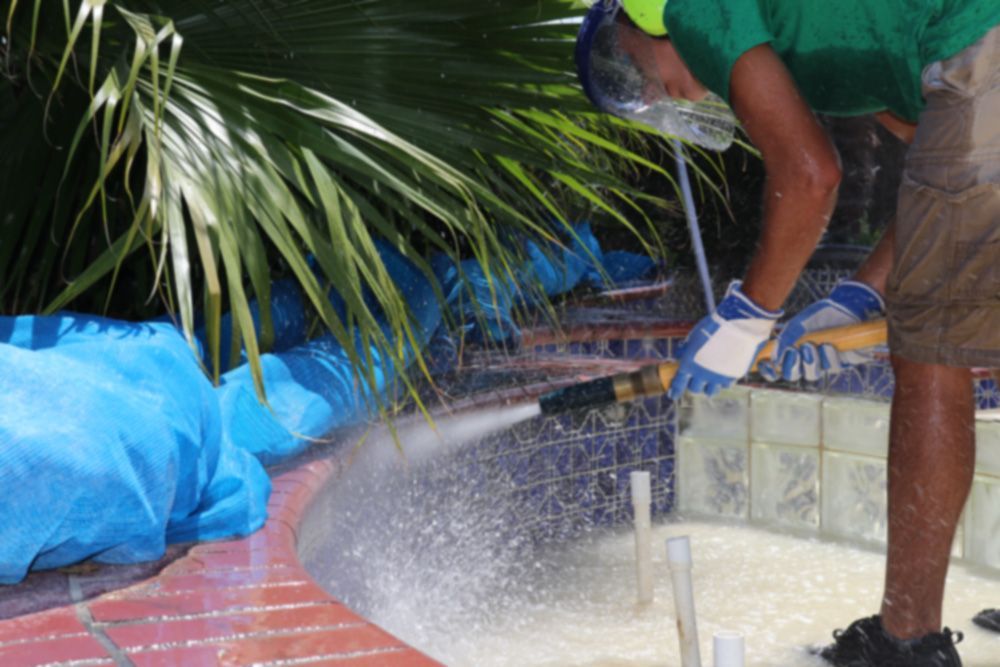 A car that has been painted half red and half gray