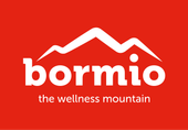 Un logo rosso e bianco per bormio la montagna del benessere