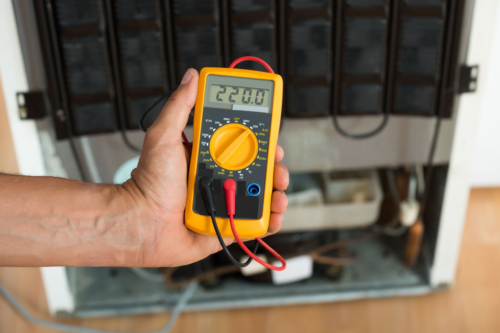 Certified technician handling fridge repair and maintenance to restore optimal cooling performance.