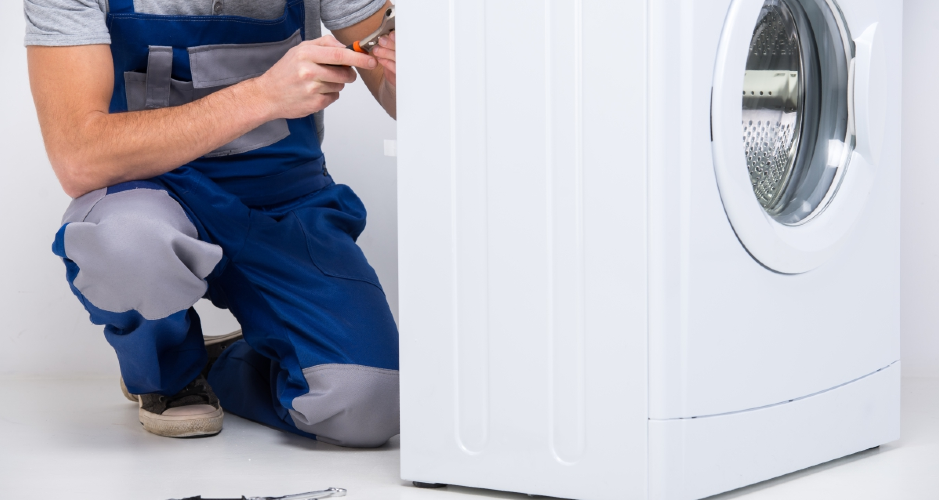 Repair Man Fixing Dryer | Omaha, NE | Andy's Appliance