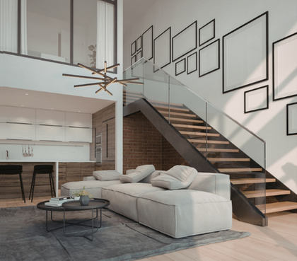 Modern open-concept living room with sectional sofa, staircase, and geometric wall art